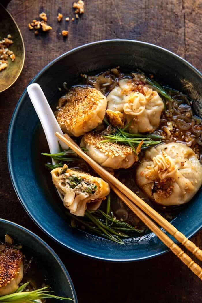 Sesame Chicken Dumplings in Spicy Broth with Garlic Crisps | halfbakedharvest.com overhead close up photo of Sesame Chicken Dumplings in Spicy Broth with Garlic Crisps