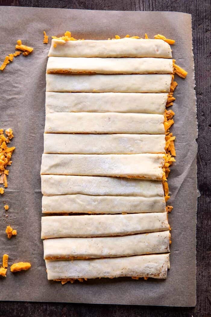 Sweet and Savory Cheesy Bacon Wrapped Puff Pastry Twist | halfbakedharvest.com prep photo of twisting dough