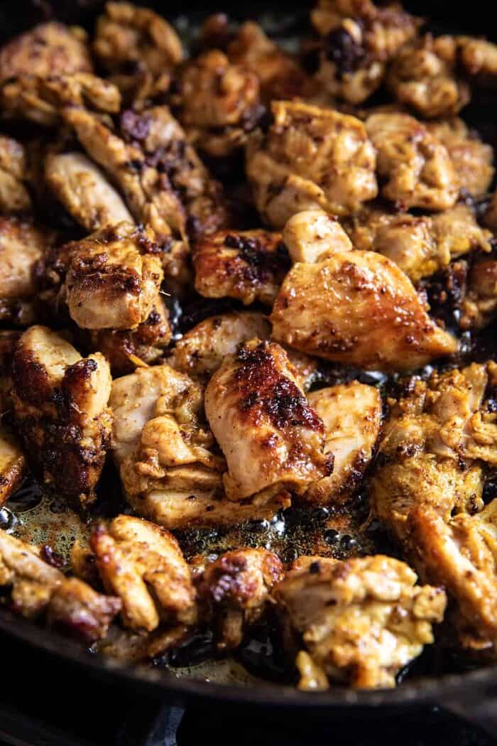 30 Minute Spicy Indian Butter Chicken | halfbakedharvest.com chicken searing in skillet