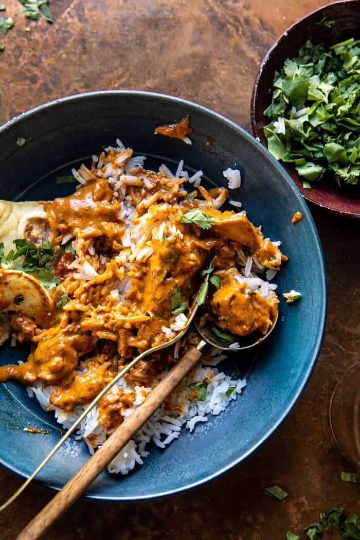 30 Minute Spicy Indian Butter Chicken | halfbakedharvest.com photo with half eaten bowl of butter chicken