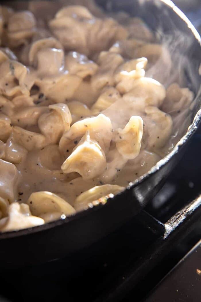 Creamy Bacon Tortellini with Charred Broccoli | halfbakedharvest.com prep photo of Creamy Bacon Tortellini in skillet