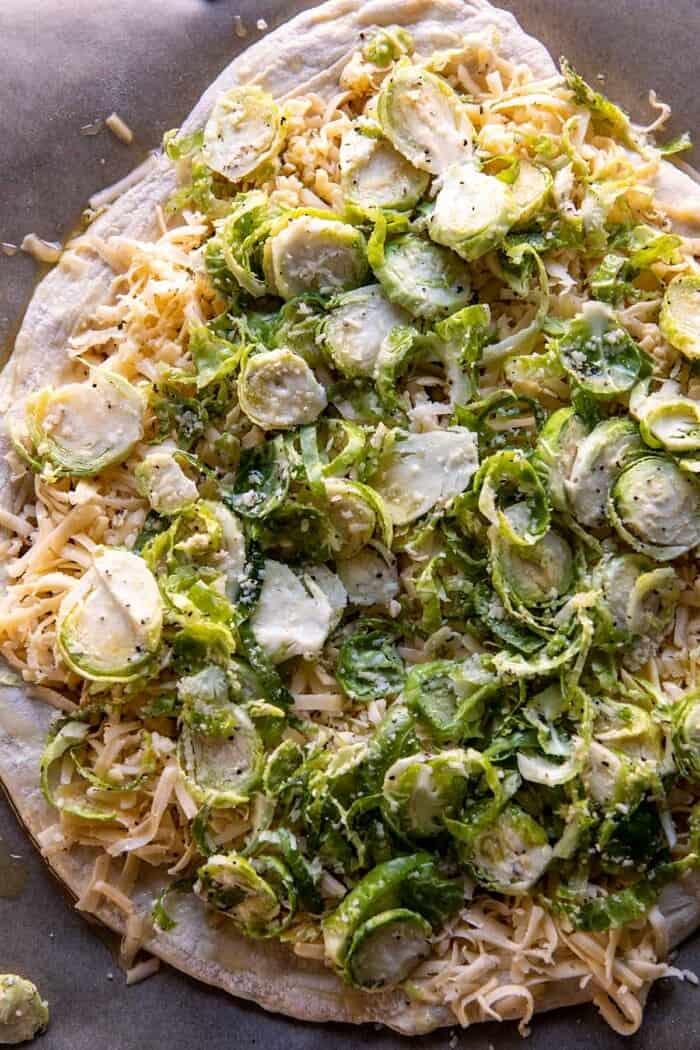 Shredded Brussels Sprout and Bacon Pizza | halfbakedharvest.com prep photo of Shredded Brussels Sprout and Bacon Pizza before cooking