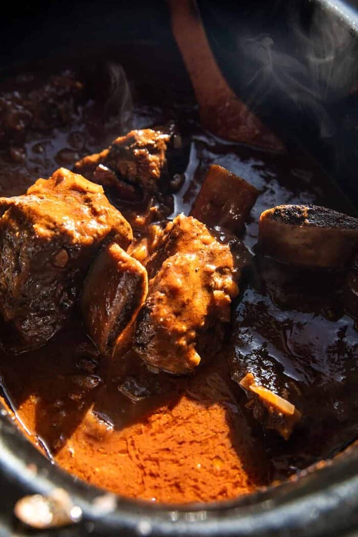 Slow Cooker Red Wine Braised Short Rib Pasta | halfbakedharvest.com ribs in slow cooker before shredding