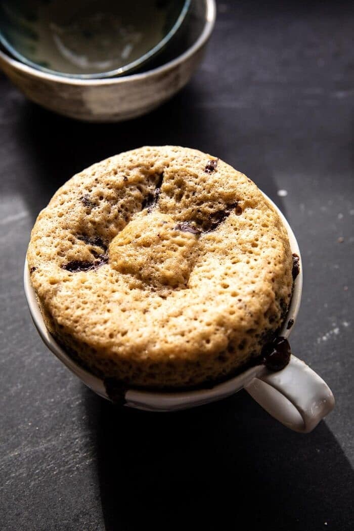 5 Minute Chocolate Chunk Banana Bread Mug Cake | halfbakedharvest.com overhead photo fo 5 Minute Chocolate Chunk Banana Bread Mug Cake