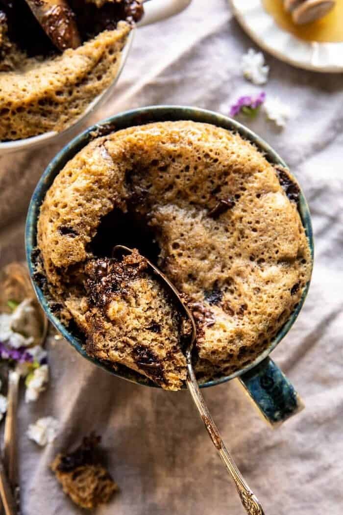 5 Minute Chocolate Chunk Banana Bread Mug Cake | halfbakedharvest.com overhead photo of 5 Minute Chocolate Chunk Banana Bread Mug Cake