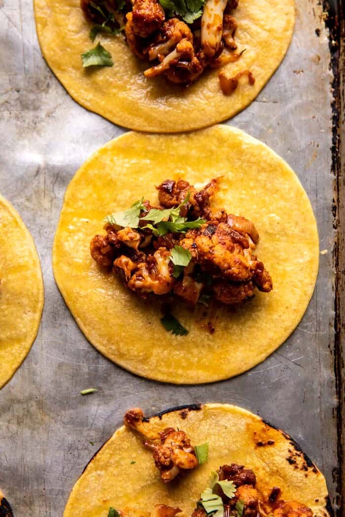 prep photo of Crispy Cauliflower Tinga tacos being assembled 
