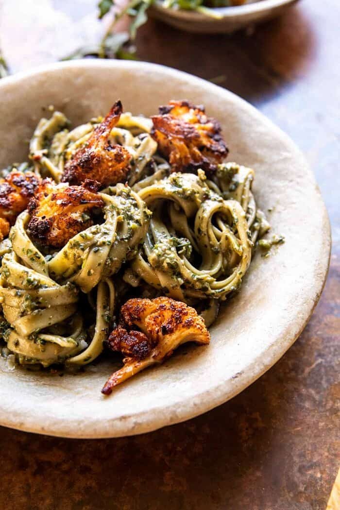 Crispy Roasted Cauliflower with Creamy Pesto Pasta | halfbakedharvest.com side angled photo of Crispy Roasted Cauliflower with Creamy Pesto Pasta