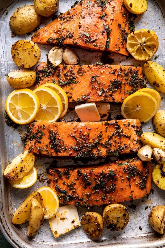 Sheet Pan Roasted Lemon Garlic Butter Salmon with Feta and Olives | halfbakedharvest.com salmon on baking sheet before cooking