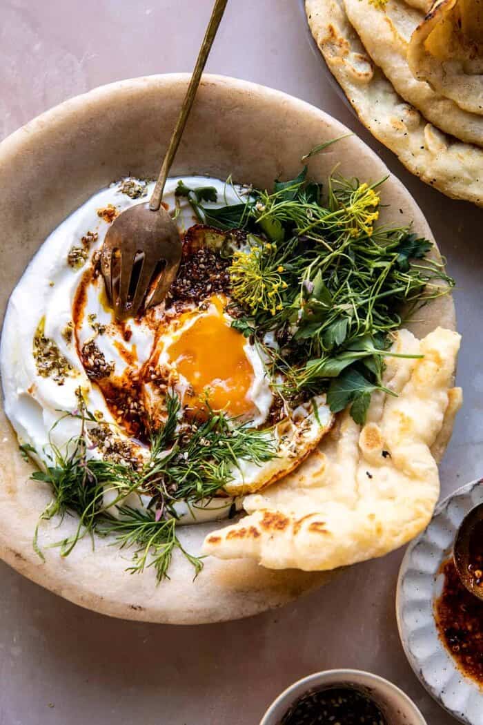 overhead photo of Za’atar Eggs with Lemony Yogurt and Herbs