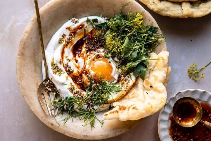 overhead horizontal photo of Za’atar Eggs with Lemony Yogurt and Herbs 