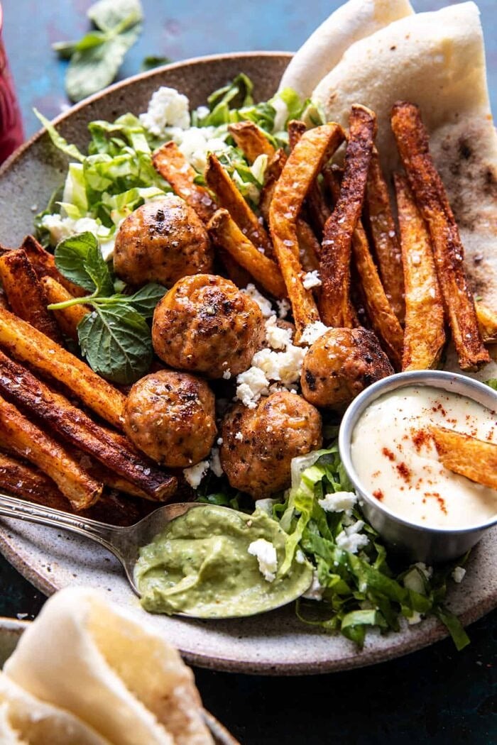 Chicken Meatball Pita Bowls with Seasoned Fries and Feta | halfbakedharvest.com close up photo of Chicken Meatball Pita Bowls with Seasoned Fries and Feta
