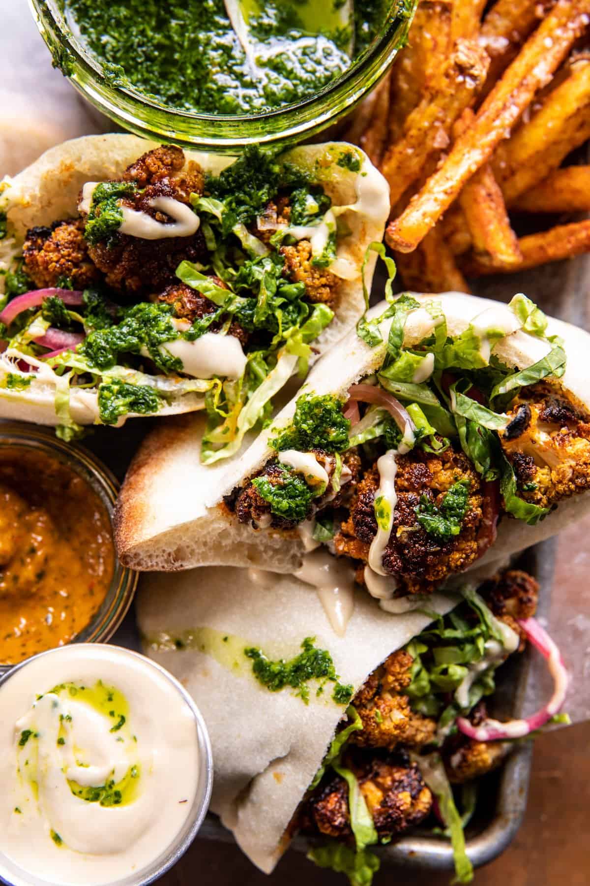 Roasted Cauliflower Pitas with Zhug and Garlic Tahini | halfbakedharvest.com