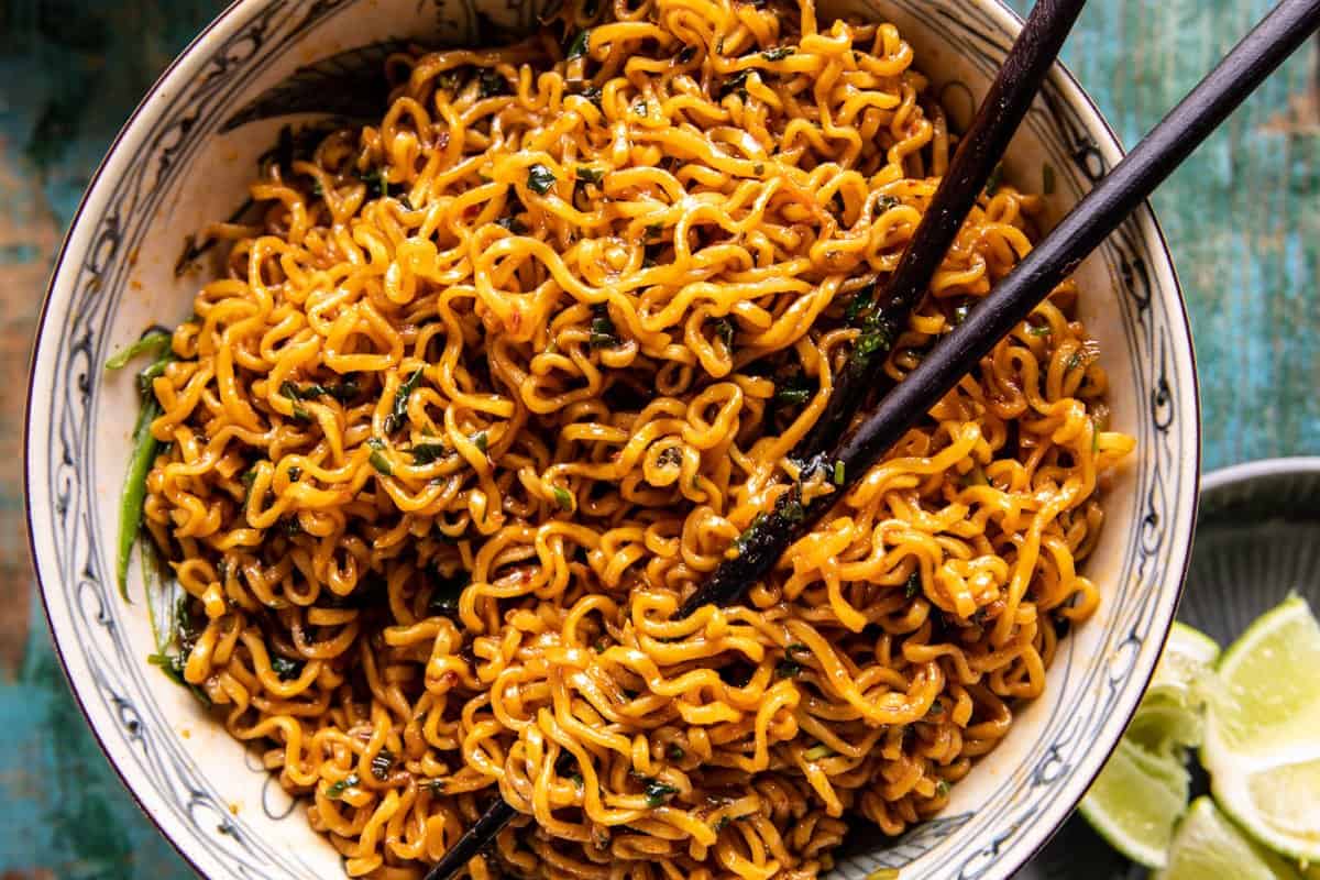 20 Minute Red Curry Basil Garlic Oil Noodles in a bowl with chopsticks