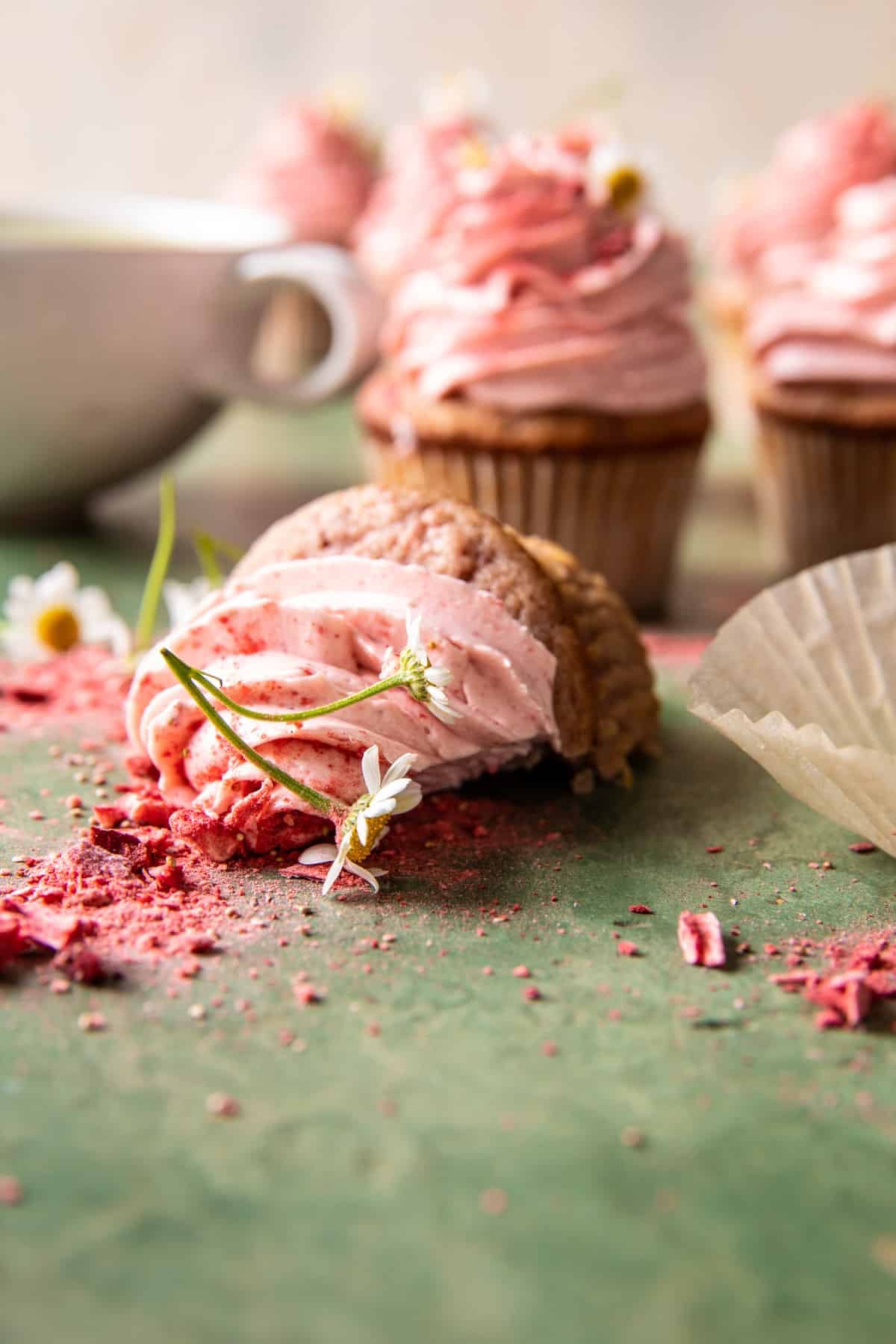 half eaten strawberry cupcake