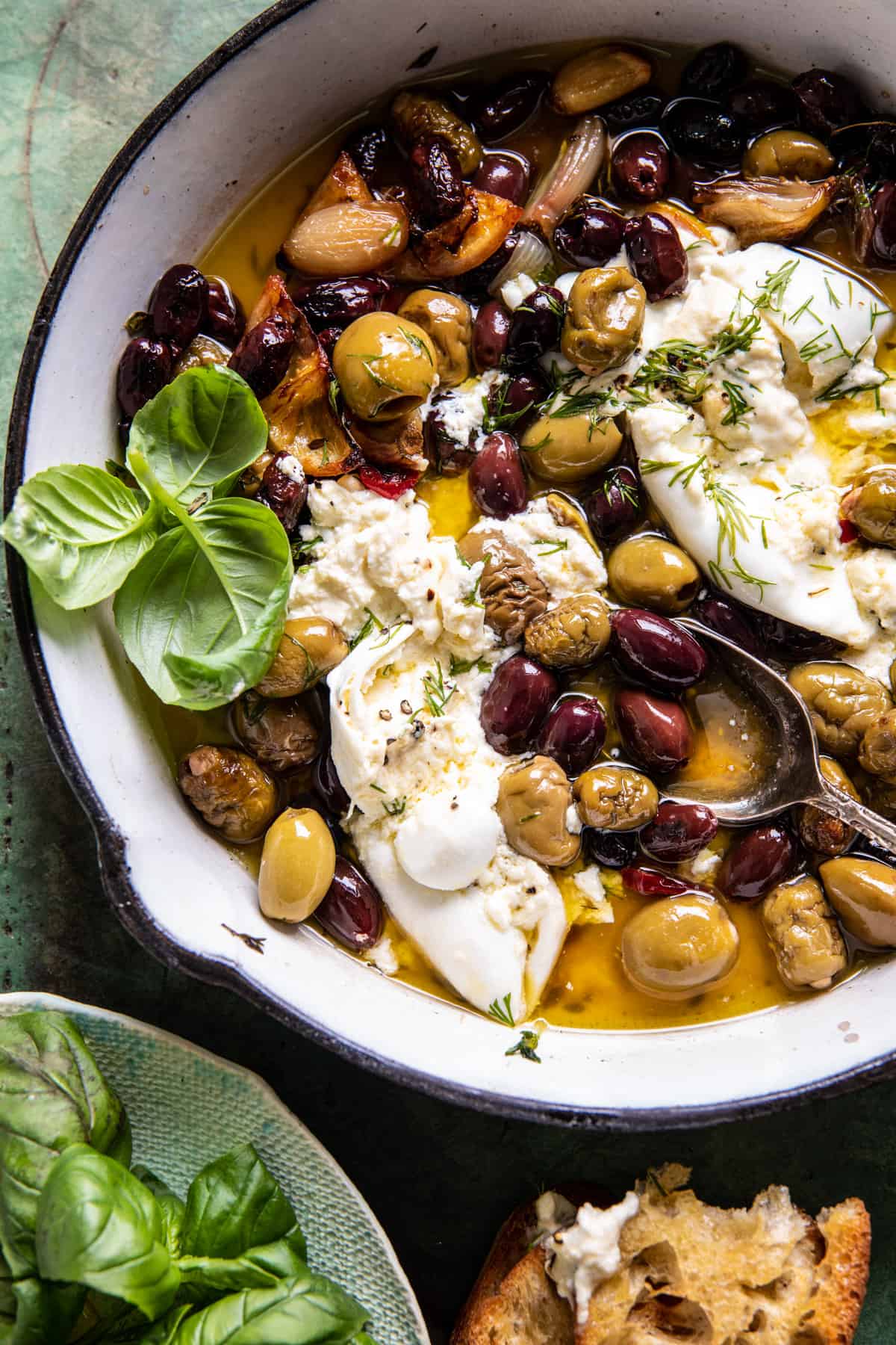 olives in roasting pan with burrata