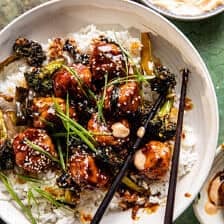 overhead photo of meatballs in bowl with rice and chopsticks