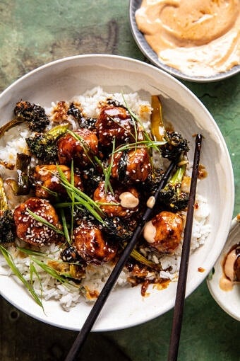 overhead photo of meatballs in bowl with rice and chopsticks