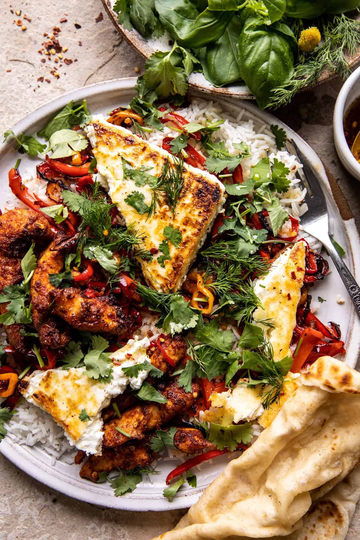 overhead photo of crispy Feta with Lemon Pepper Chicken and Rice and naan