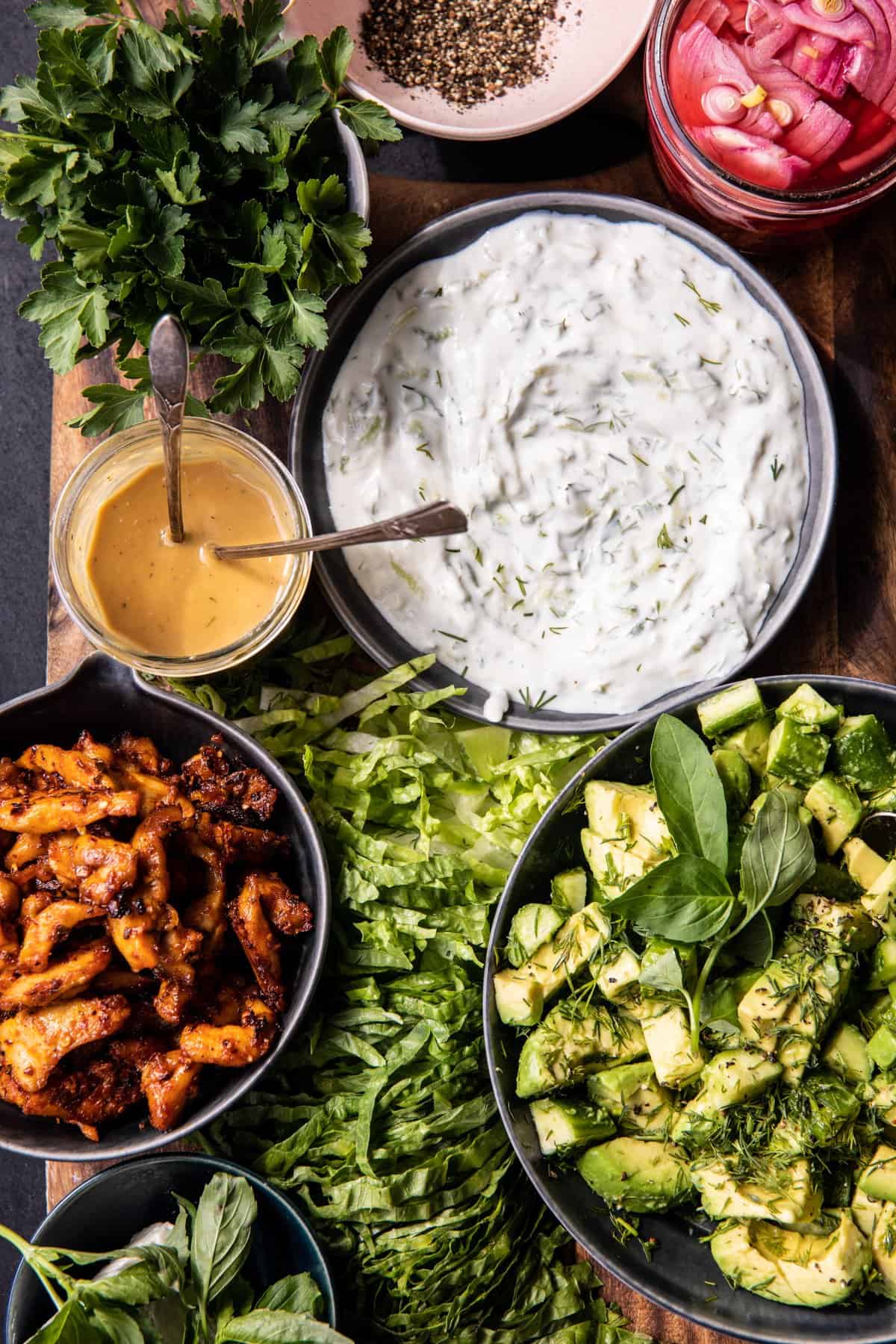 ingredient photo of chicken, lettuce, tahini, and Tzatziki