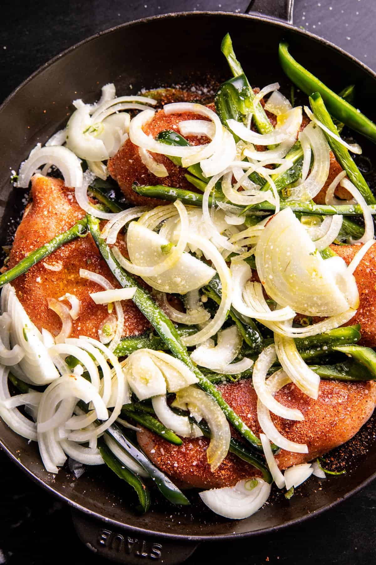 photo of chicken before baking in skillet 