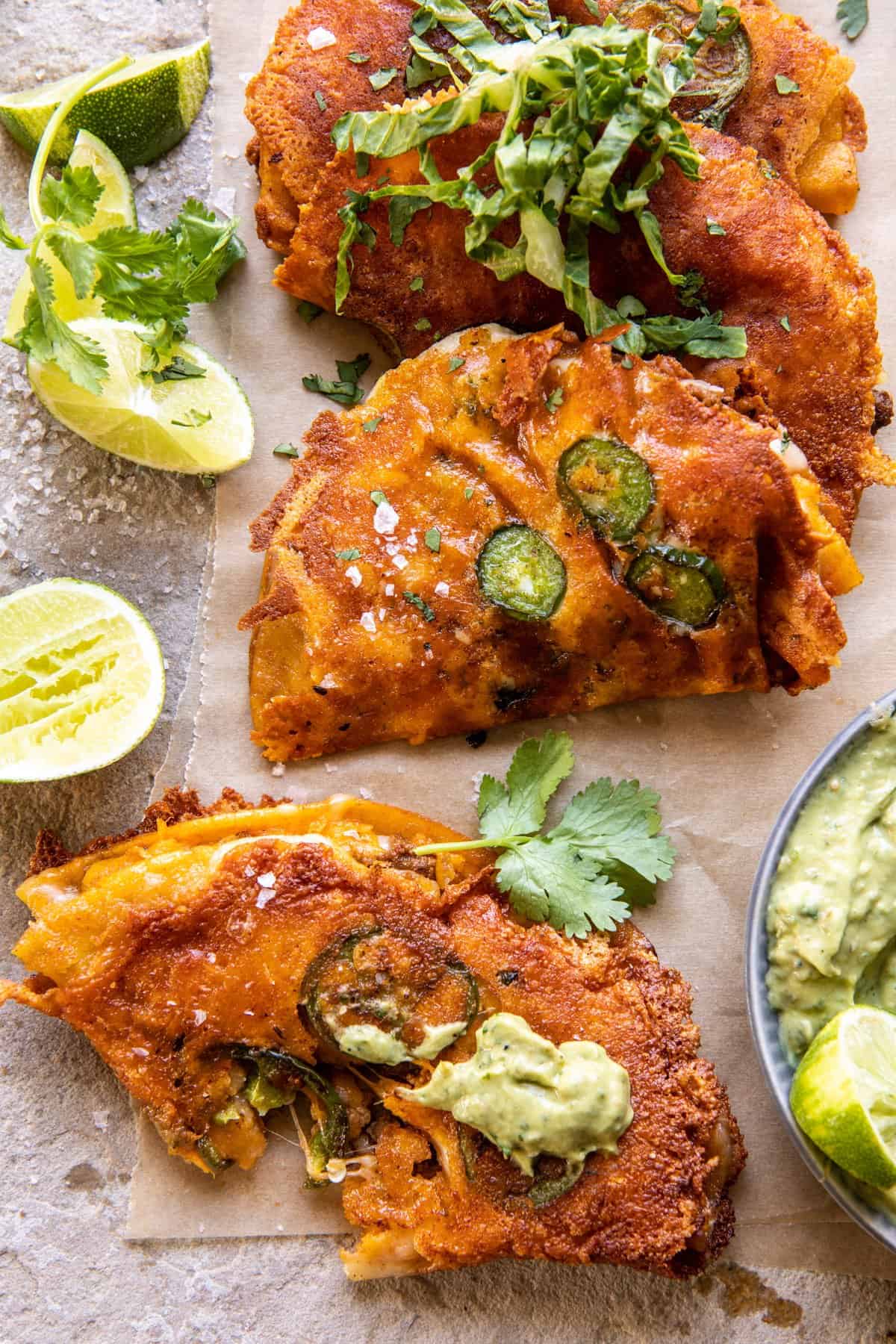 Crispy Cheese Chicken Tacos with Avocado Cilantro Sauce | halfbakedharvest.com