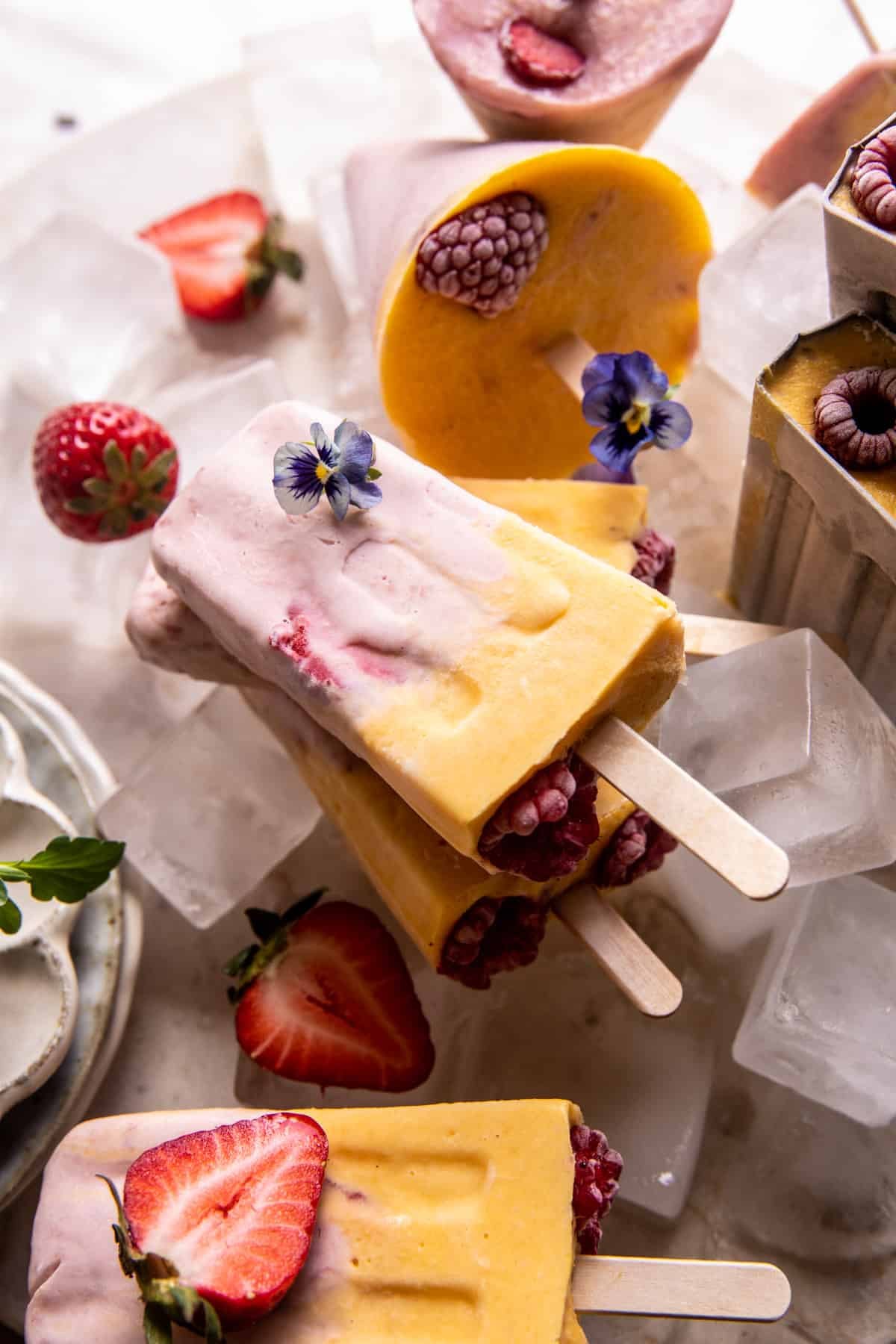 Creamy Strawberry Mango Popsicles | halfbakedharvest.com