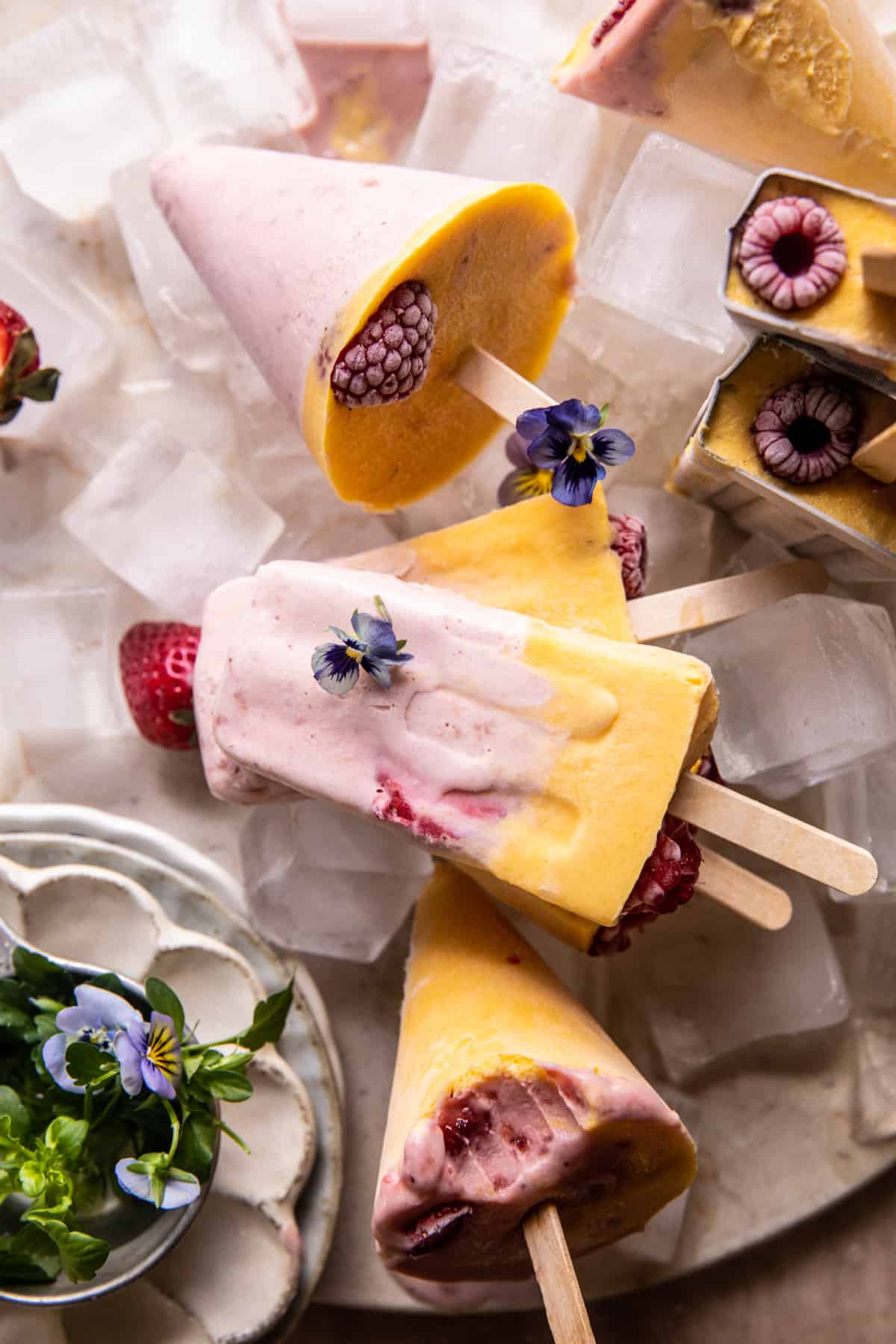 Creamy Strawberry Mango Popsicles | halfbakedharvest.com